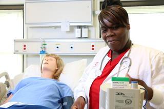 Student pursing an associate degree nursing in classroom at Donnelly College. They are in programs such associate degrees, bachelor's degrees such as business leadership and information systems and information technology or nursing programs. Students get scholarships and financial aid at Donnelly which helps to make Donnelly the most affordable private college in Kansas or Missouri. 